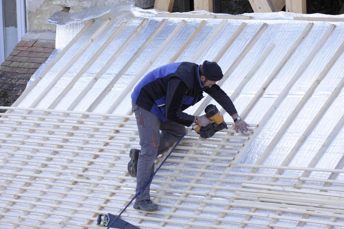 man installing a roof