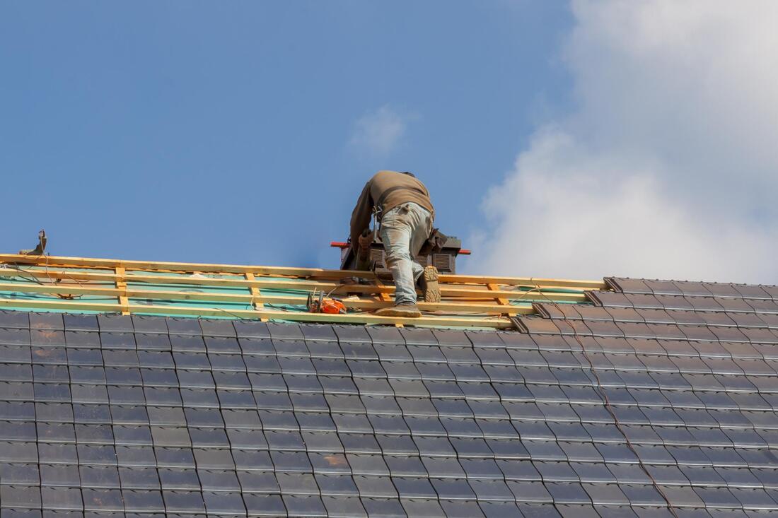 man repairing a roof