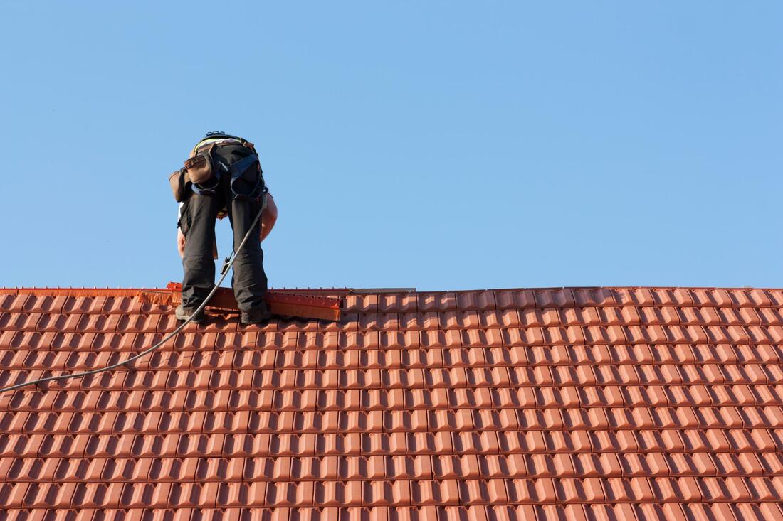 man repairing a roof